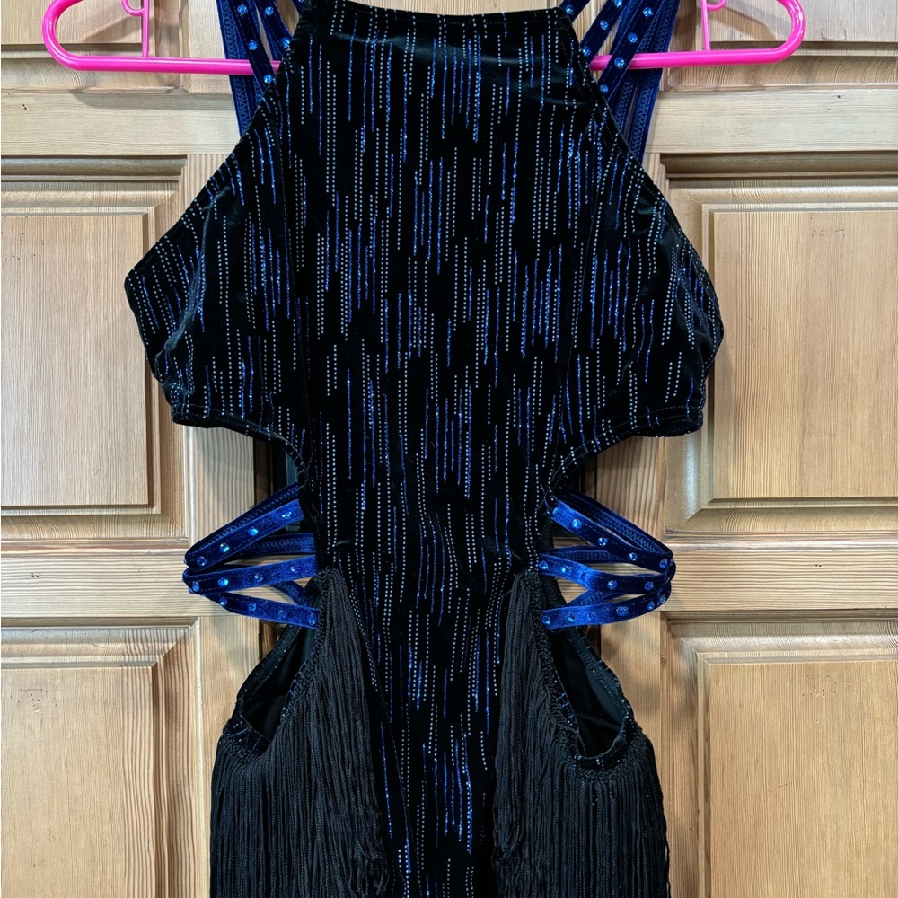 Leotard with cut outs and fringe skirt.